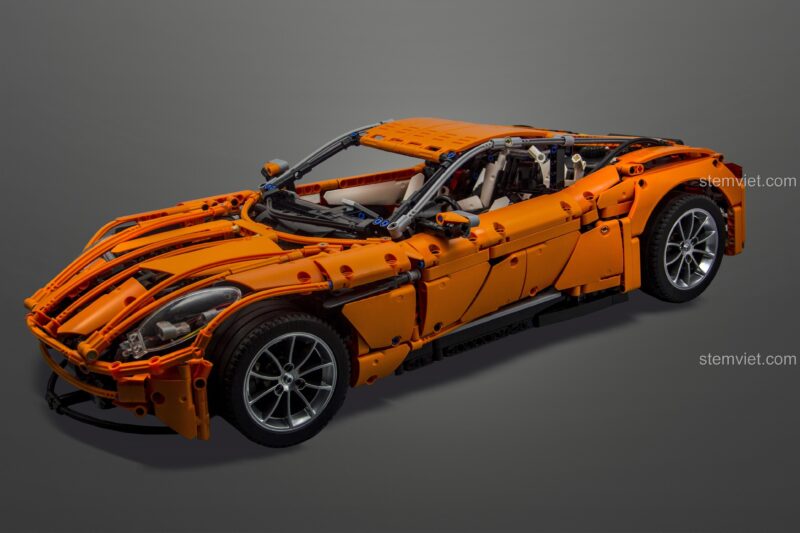 Mô hình xe Aston Martin DB11 Carolyn's CJ-2002 màu cam, đồ chơi lắp ráp chi tiết cao, phù hợp bé trai 14 tuổi.