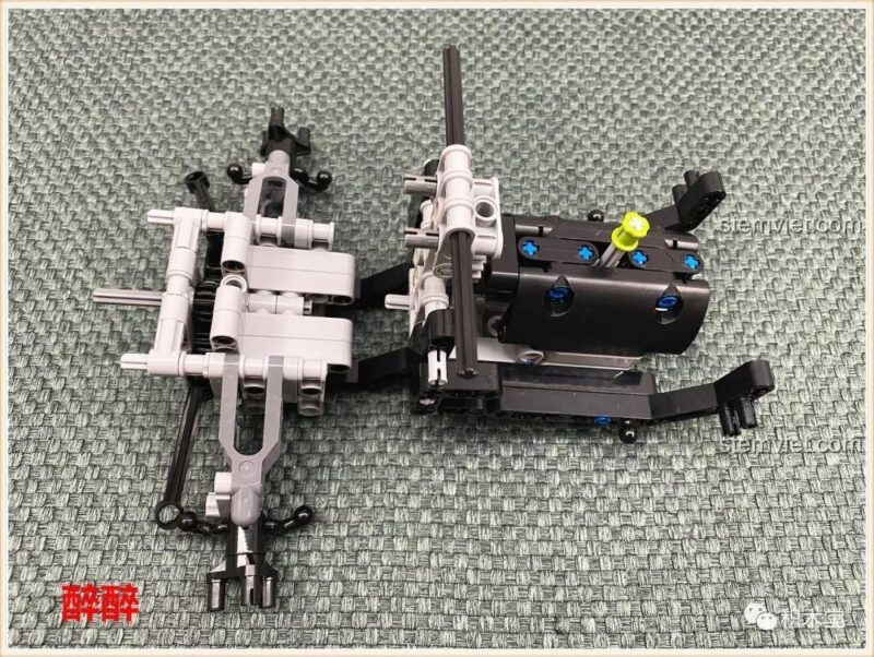 Lắp ráp hệ thống truyền động và động cơ mô phỏng của xe tải địa hình Happy Build 1211, mang lại trải nghiệm lắp ghép chân thực.