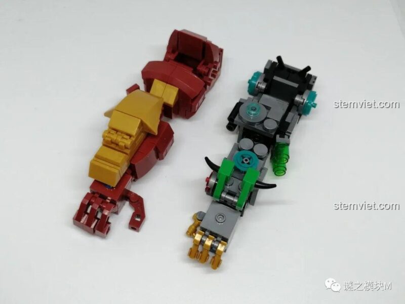 Ảnh review chi tiết phần cánh tay của mô hình Hulkbuster LW 2081, so sánh giữa lớp giáp và phần cơ khí.