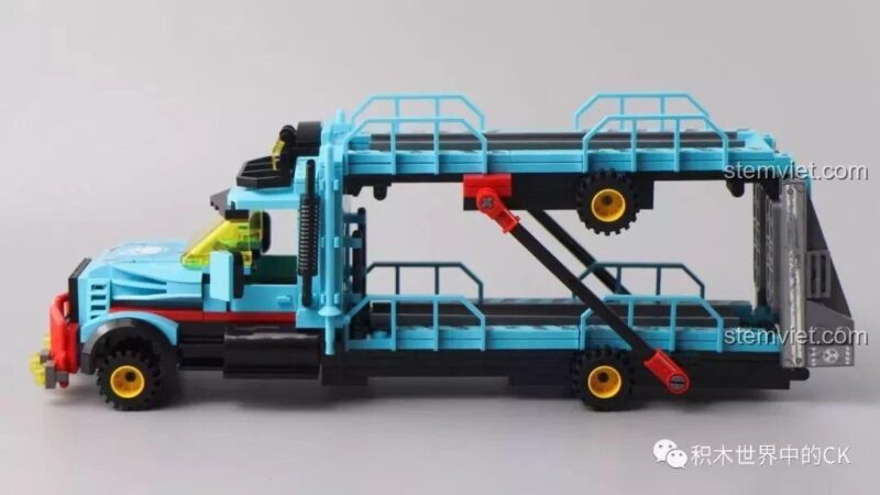 Xe tải vận chuyển 2 tầng màu xanh lam nổi bật, một phần của bộ đồ chơi QMAN 1929.
