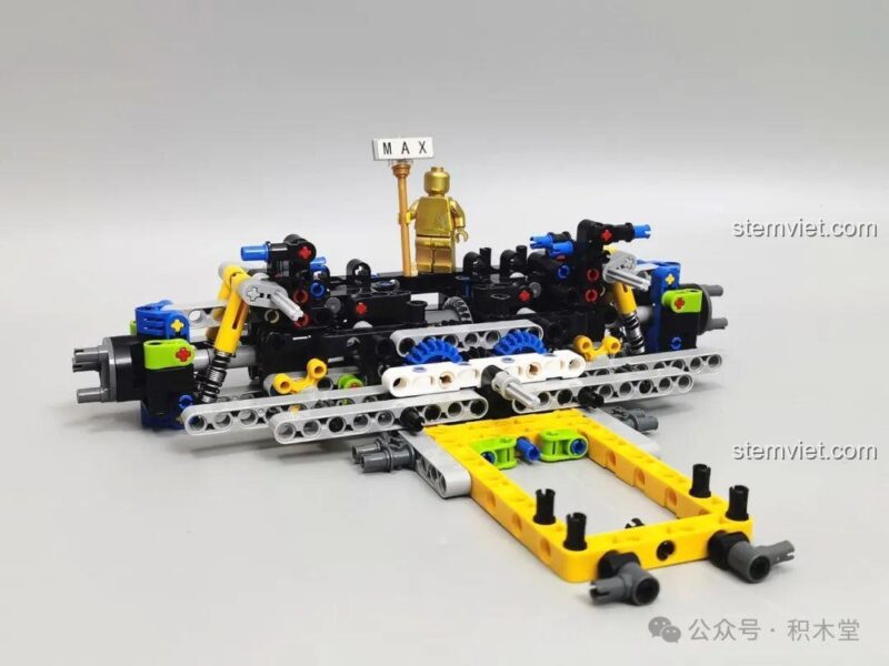 Quá trình lắp ráp khung gầm và hệ thống treo sau của bộ xếp hình L7001, thể hiện cấu trúc cơ khí phức tạp.