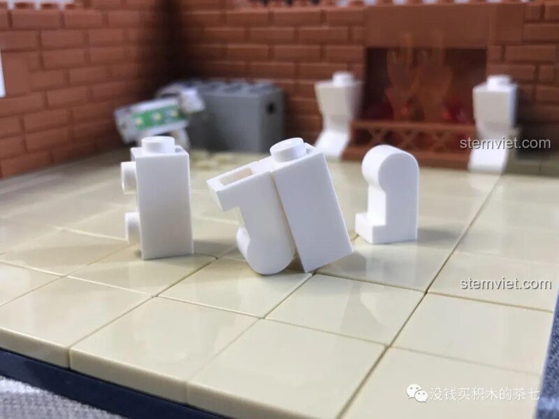 Chân lò sưởi bộ lắp ghép Wekki 506001 Ngôi Nhà Giáng Sinh Wekki, thiết kế độc đáo với các mảnh ghép hình chân người.