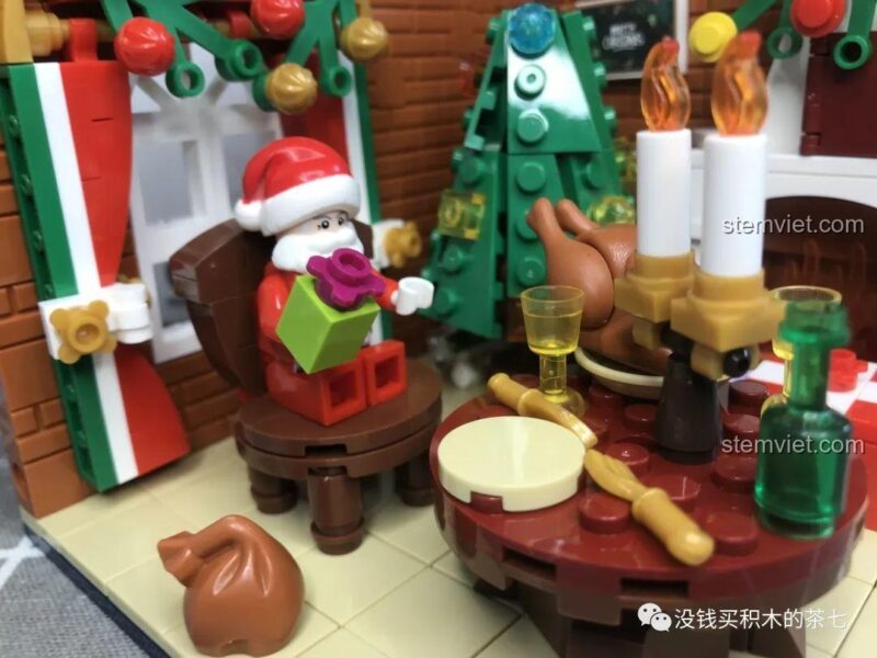 Minifigure Ông già Noel nhìn từ phía trước của bộ lắp ráp Wekki 506001 Phòng Tiệc Giáng Sinh, trang phục đỏ trắng đặc trưng.