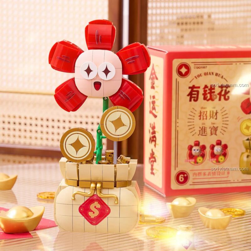 Mô hình Cây Hoa Tiền Tài CoolFun được đặt trên bàn làm việc, là một vật phẩm phong thủy chiêu tài và là món quà ý nghĩa.