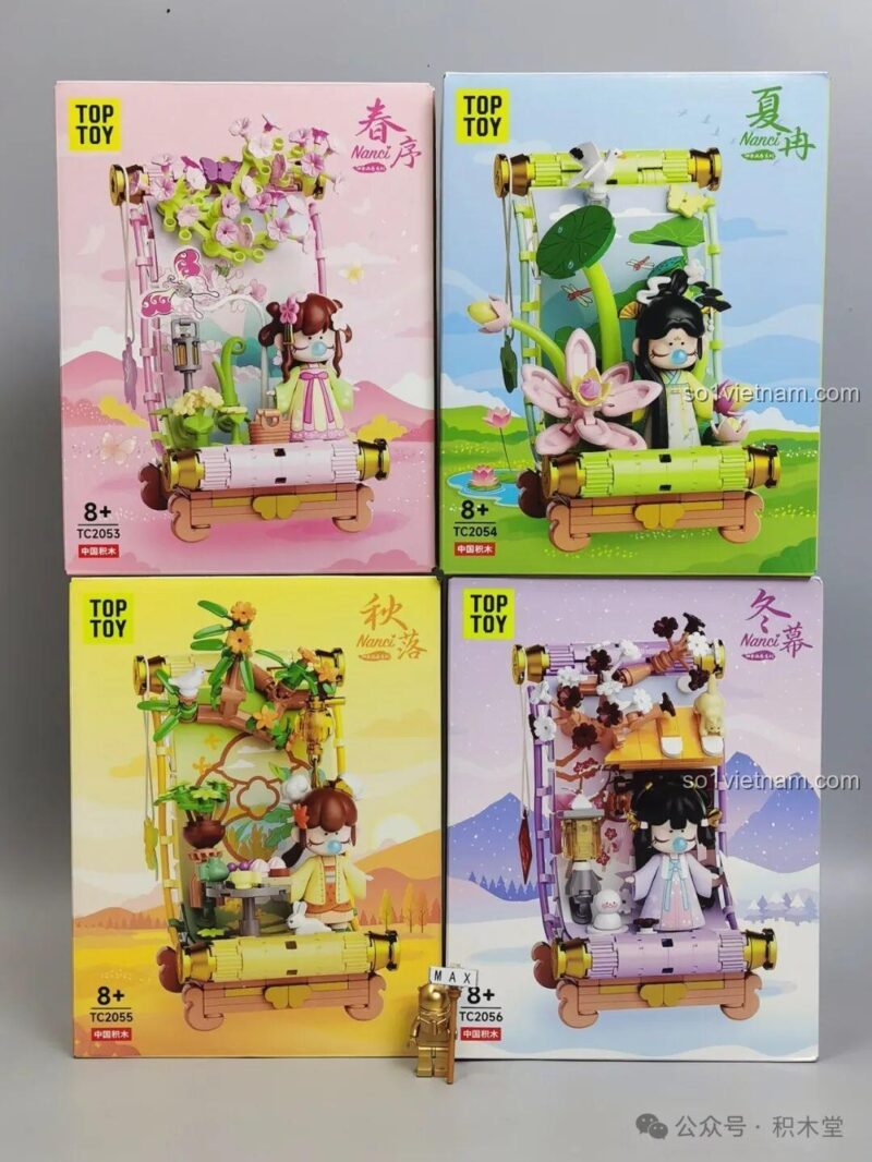 Ảnh chụp 4 hộp sản phẩm của bộ sưu tập TOP TOY Bức Tranh Cuốn Bốn Mùa, trong đó có hộp TC2053 màu hồng.