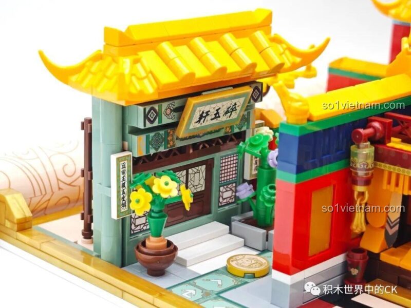Khu vực hồ nước và sân vườn trong Board game 518 001 Wekki, với hoa sen và đá trang trí.